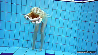 Petite teen Milana Voda endures the free naked swimming