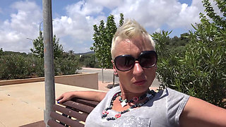 Short hair blonde babe enjoys pissing outdoors