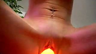 Pierced girl fucks her pussy with a lamp in hot solo scene