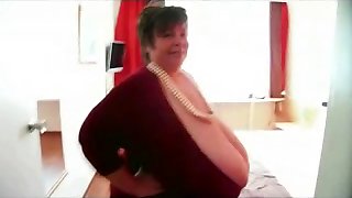 Mature 56KKK Massive Tits in a Clevage Busting Outfit