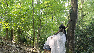 Ebony bride and white groom are having sex in the woods