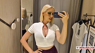 Trying on completely transparent clothes in the fitting room. Look at my boobs in a public place.
