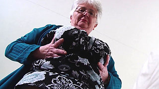 Fat granny Caroline V caresses her pussy
