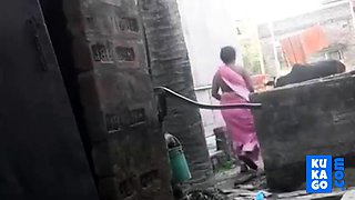 Voyeur - Indian BBW bathes outside