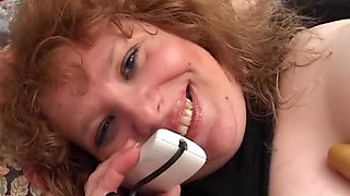 Amateur fat woman plays in her bed with some dildos