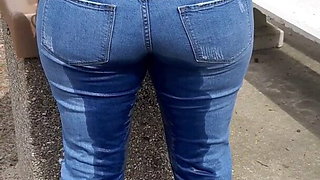 Woman wets jeans in park
