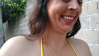 Amateur wife teasing you outside wearing a micro bikini