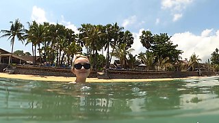 Lovita Fate, sexy angel in bikini by the pool