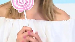 Marvelous blonde with perfect body touches her cunt with sweet candy