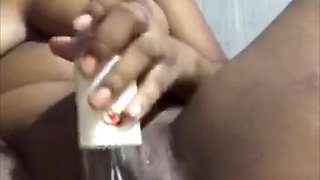 Sexy African Girl Masturbating with a Little Bottle...