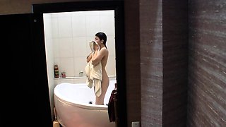 Stunning brunette getting of the shower naked