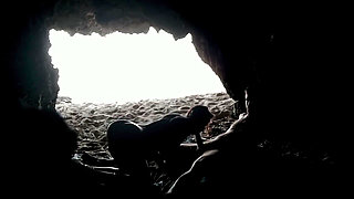 Couple recorded at the beach, inside the cave