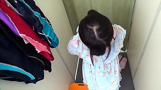 Voyeur spying on a pretty Japanese teen in the dressing room