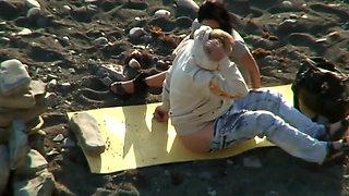 Couple on beach voyeur filming