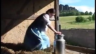 Milena milks herself at a farm