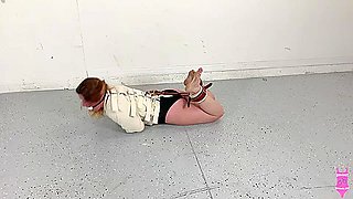 Fayth on Fire in a Posey straitjacket, ball gagged, and hogtied