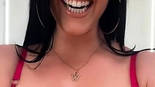 A super sexy brunette massages her big boobs