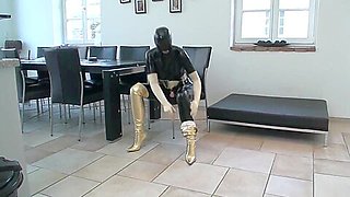 Big Tits Girl In Black Latex Catsuit + Mask + Gloves Piss In Golden Boots